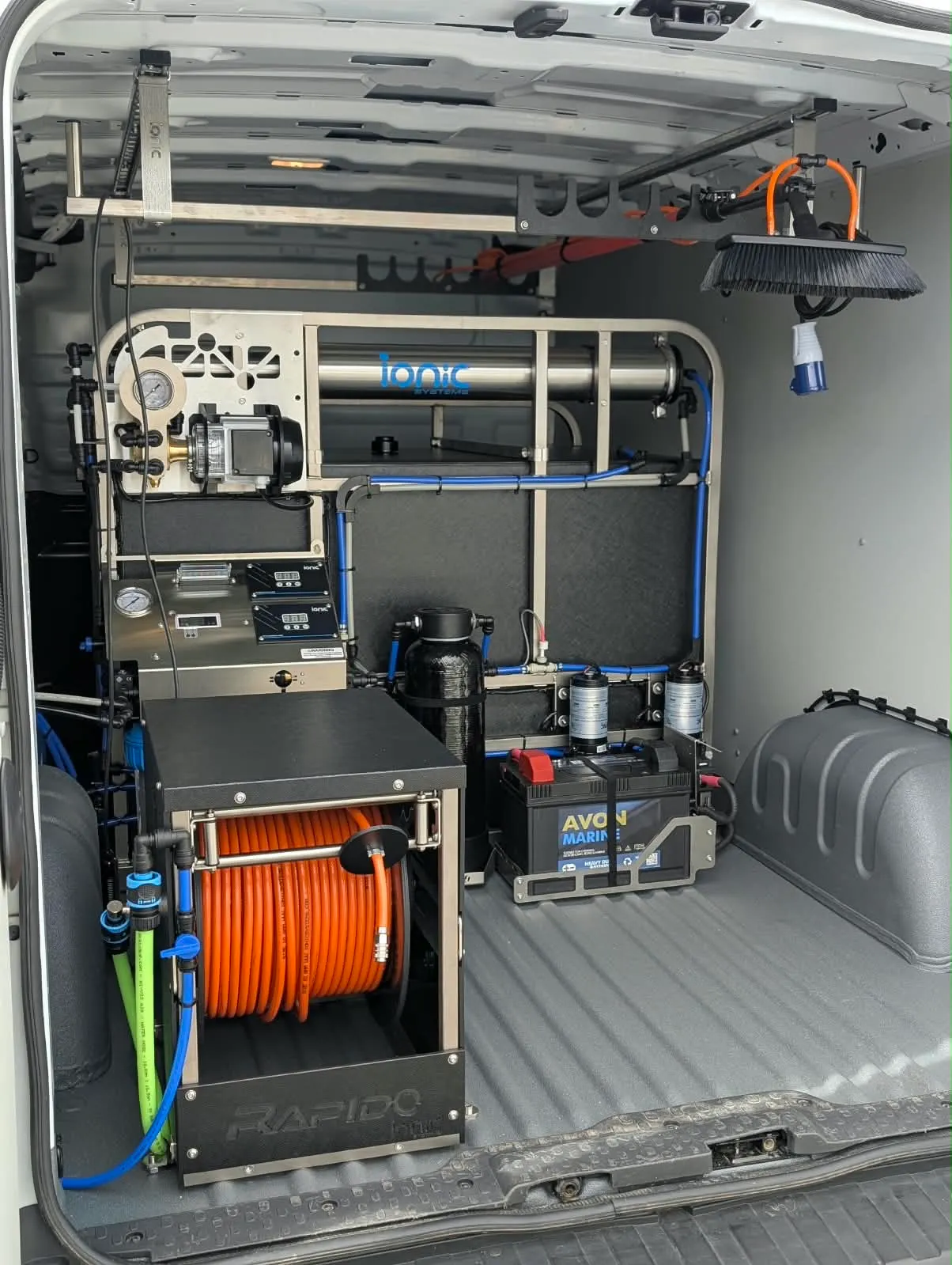 The Ionic pure water filtration system and hose reel inside the Mint window cleaning van