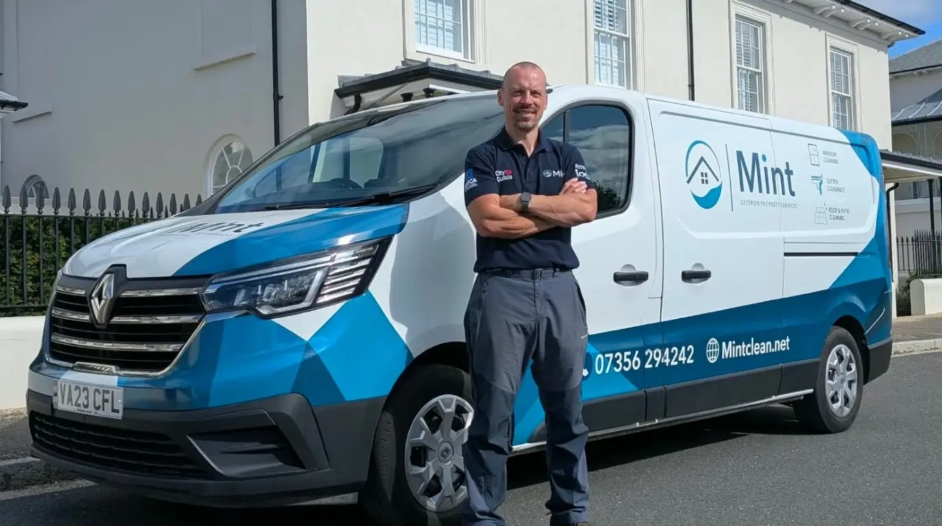 Tom from Mint with the window cleaning van outside a Dorchester townhouse