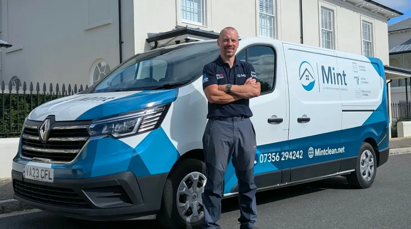 Tom from Mint with the window cleaning van outside a Dorchester townhouse